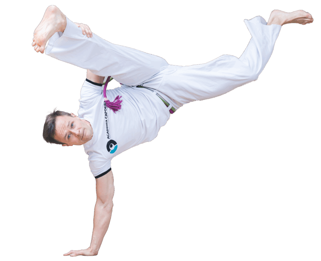 Instruktor Academia Capoeira wykonujący au batido w Łodzi